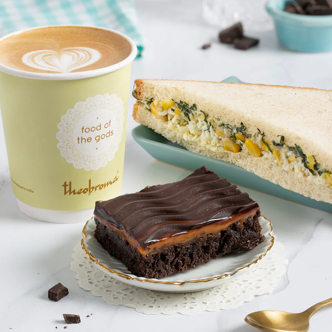 Choice of Beverage + Eggless Brownie + Veg Sandwich/Savoury